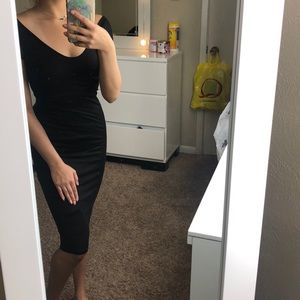 Tight and mid-length black dress